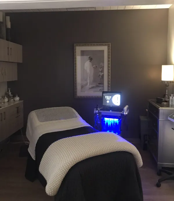 Simply Faces treatment room with professional facial equipment